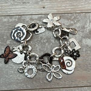 Funky Boho Chunky Bracelet with 15 Fun Charms. 7 1/2” long. Bar/loop closure